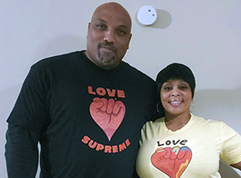 Couple wearing Love Supreme T-shirts