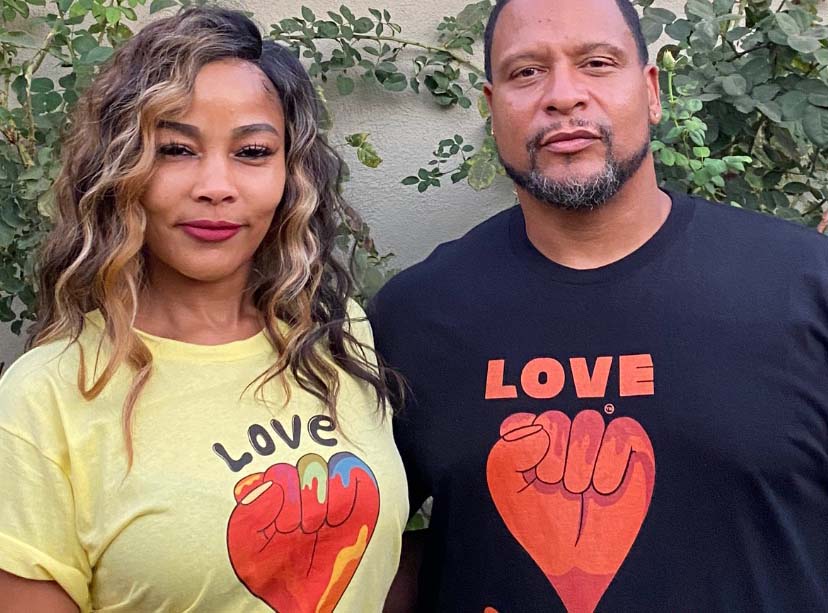 Couple wearing Love Supreme t-shirts