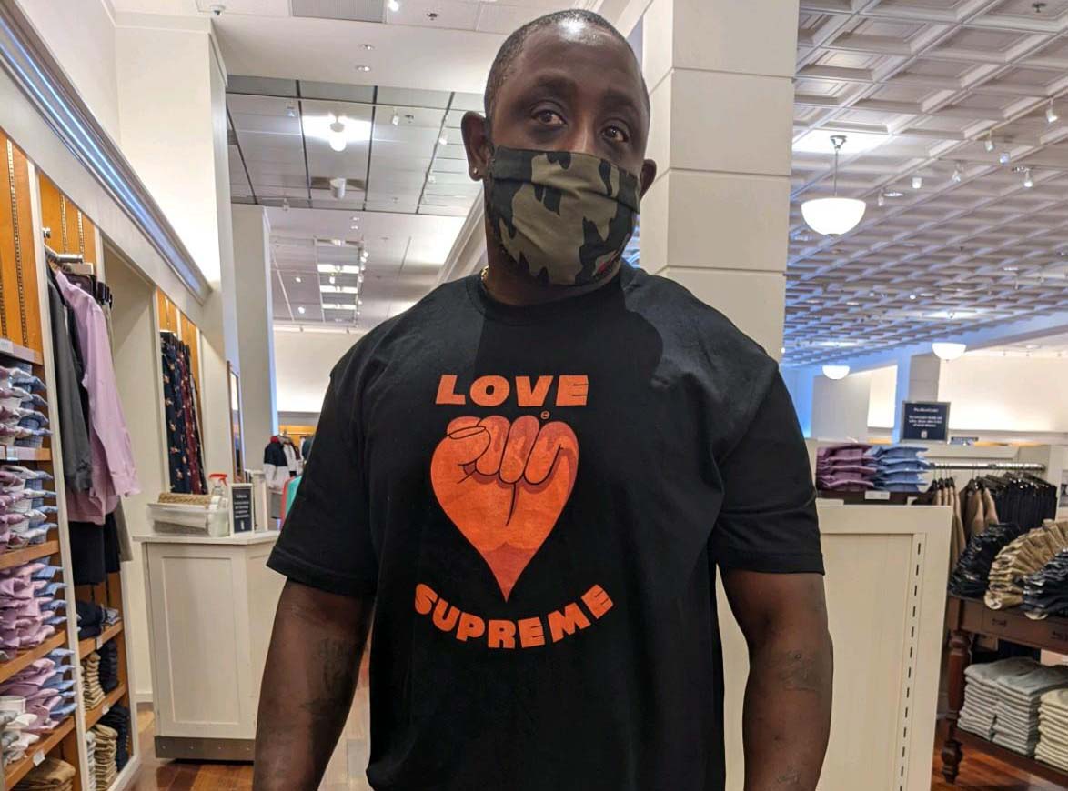 Man wearing Love Supreme t-shirt