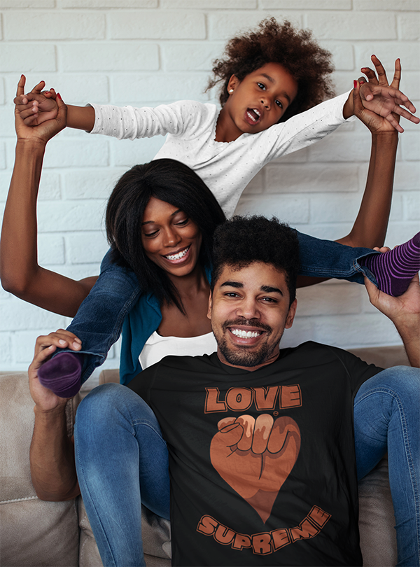 Family playing wearing Love Supreme t-shirts