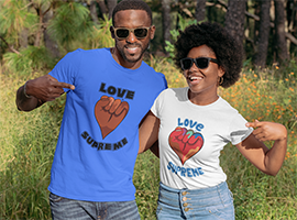 Couple in forest wearing Love Supreme t-shirts